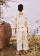 A Model Wearing White Cotton Mul Ruyi co ord set curated by Only Ethikal